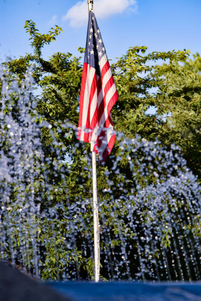 istock American Flag Behind Water Fountain 687715850