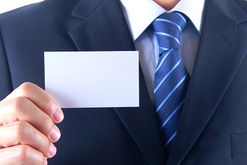 Businessman hand holding blank business card
