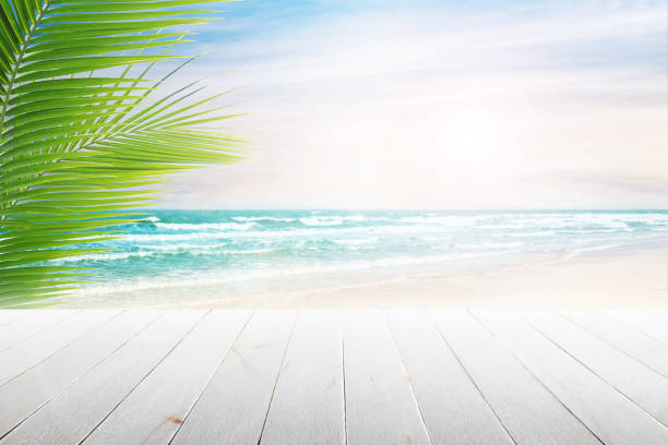istock old wood table top on blurred beach background. 687726130