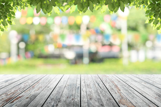 istock Empty wooden table with party in garden background blurred. 687731690