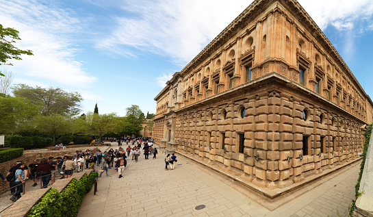 Many people and visitors coming to the Alhambra Palace in Granada, Andalusia, Spain. April 4, 2015