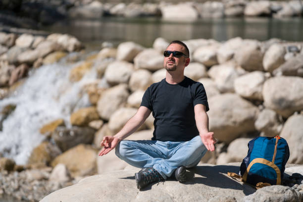 istock The Turkish man is doing yoga on the rocks 687739688