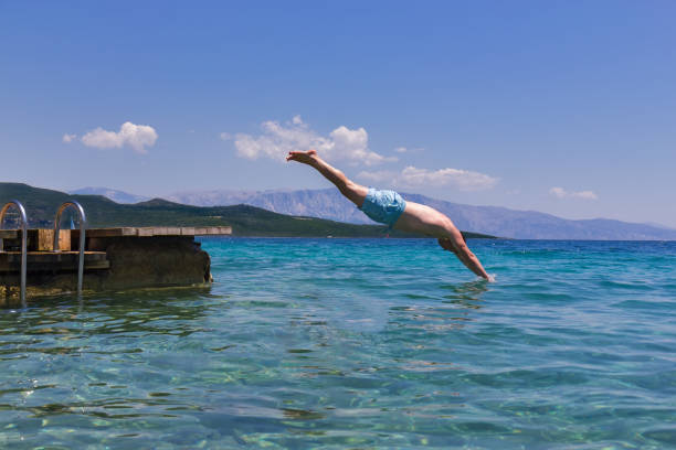 Man plunging in the pool
