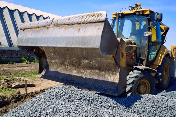 istock Laying rubble on the road with a heavy excavator. 687745186