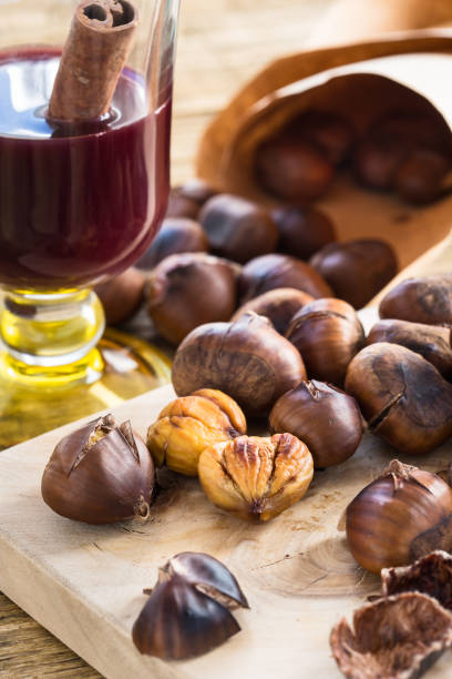 istock Delicious roasted chestnuts ready to eat and mulled wine with cinnamon 687750192