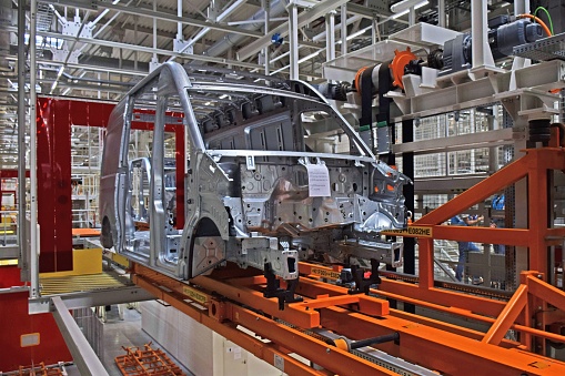 Wrzesnia, Poland - 9th September, 2016: Cars production line in Volkswagen factory in Poland. The assembly plant ensures both the production of the Volkswagen LCV model Crafter and MAN TGE. The manufacturing line was adapted for an annual capacity of 100 000 commercial vehicles.