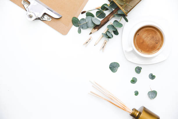 istock Blogger or freelancer workspace with clipboard and coffee on white background. Flat lay, top view. 687758660