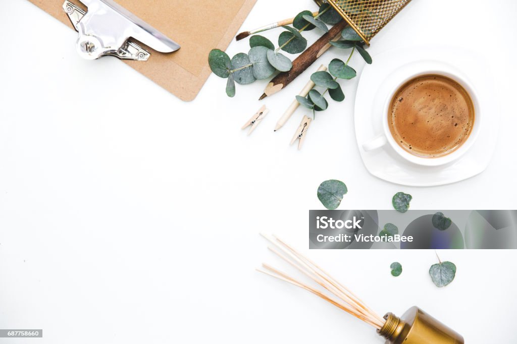 Blogger or freelancer workspace with clipboard and coffee on white background. Flat lay, top view. Blogger or freelancer workspace Women Stock Photo