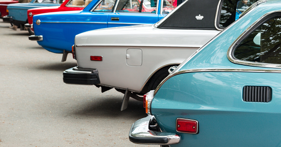 Vintage cars exposed in a row on retro show