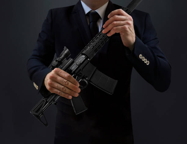 istock The Secret Service Agent Holding Machine Gun 687767470