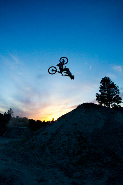 istock A young man does a backflip on his dowhill-style mountain bike at sunset. 687770218