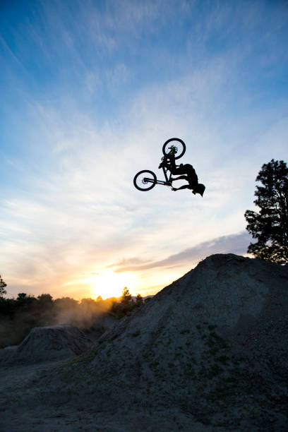 istock A young man does a backflip on his dowhill-style mountain bike at sunset. 687770224