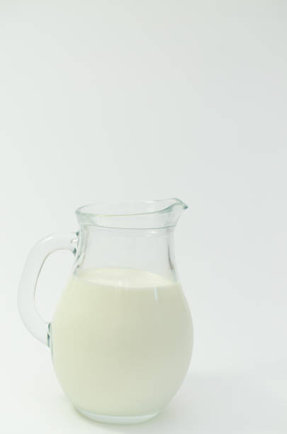 istock Fresh cow milk in a jar on a light background. 687771400