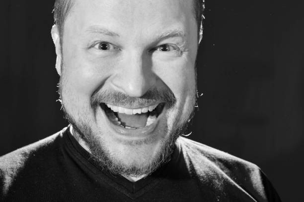 istock Portrait of middle-aged man with beard laughing 687777332