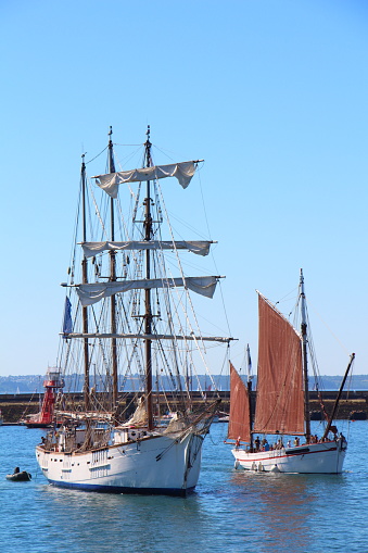 Big old  wooden sailing ship and old steamship in San Francisco Bay during springtime day