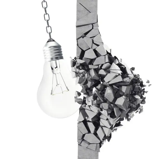 Photo of 3d rendering light bulb, demolishing wall smithereens, concept of creative thinking and innovation.