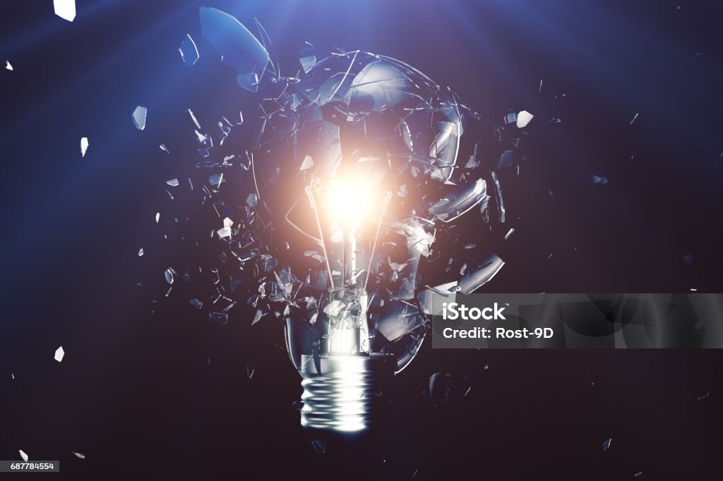 Exploding Light Bulb On A Blue Background With Concept Creative ...