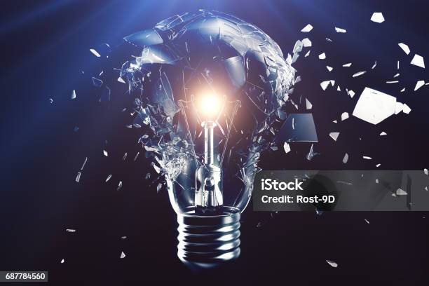 Exploding Light Bulb On A Blue Background With Concept Creative Thinking And Innovative Solutions 3d Rendering Stock Photo - Download Image Now