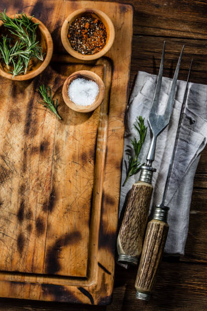istock Cutting board, vintage cutlery set and spices. Copy space, menu cooking concept 687784748