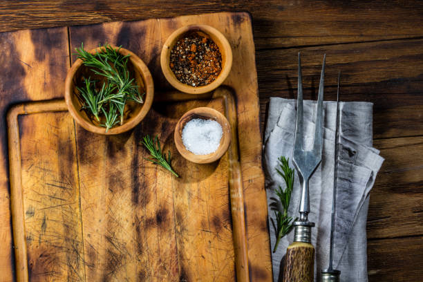 istock Cutting board, vintage cutlery set and spices. Copy space, menu cooking concept 687784750