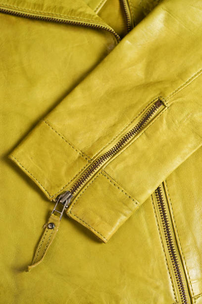 istock Green leather jacket zippers. Leather jacket macro details. Jacket zippers and pockets 687790118