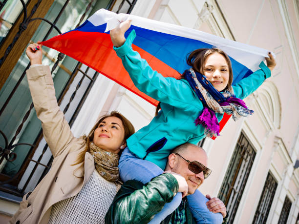 istock Real Russian family with National flag 687790988