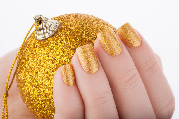 istock Beautiful golden manicure. 687794754