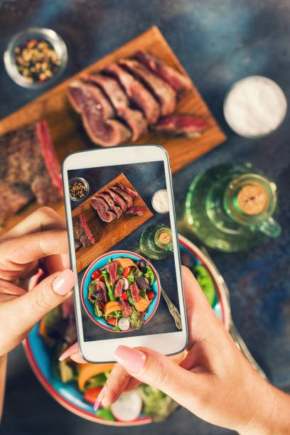 taking photo of spicy beef steak salad - steak plate gourmet beef imagens e fotografias de stock