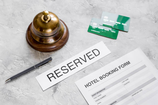istock reservation form on hotel reception stone desk background 687798084