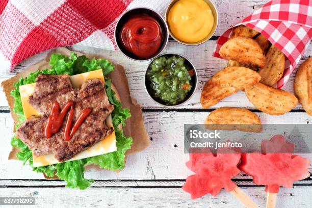 Canada Day Picnic Scene With Maple Leaf Hamburger And Watermelon Stock Photo - Download Image Now