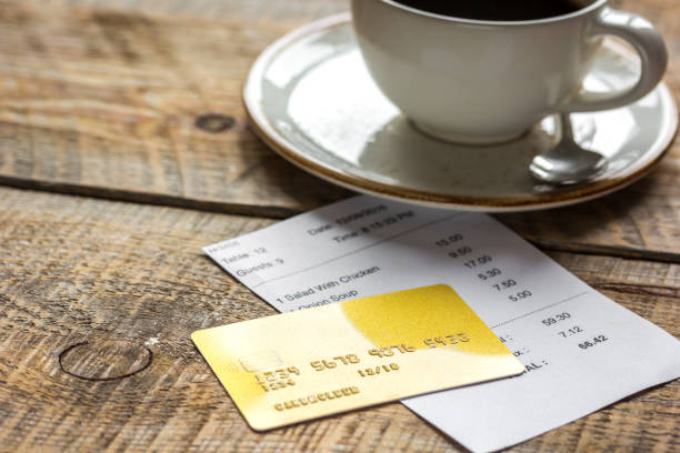 istock restaurant bill paying by credit card for coffee on wooden table background 687803074