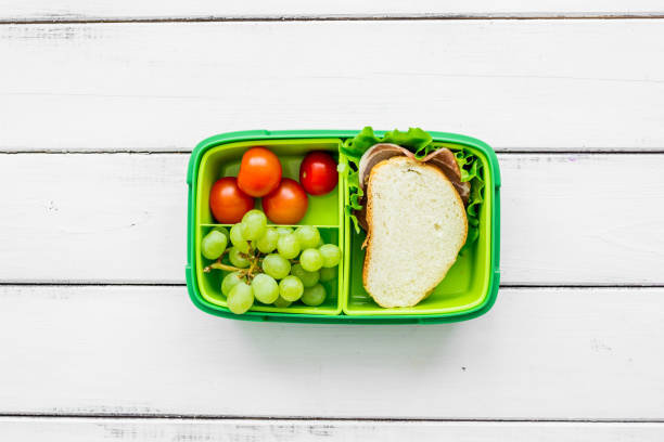 istock school lunch set with sandwich and vegetables in lunchbox background top view 687803330