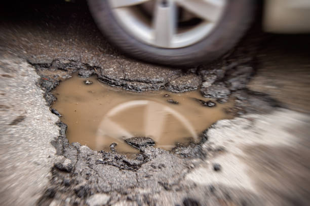 Large pothole in Montreal, Canada. stock photo