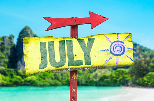 July sign with beach background