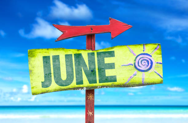 June sign June direction sign with beach background june stock pictures, royalty-free photos & images