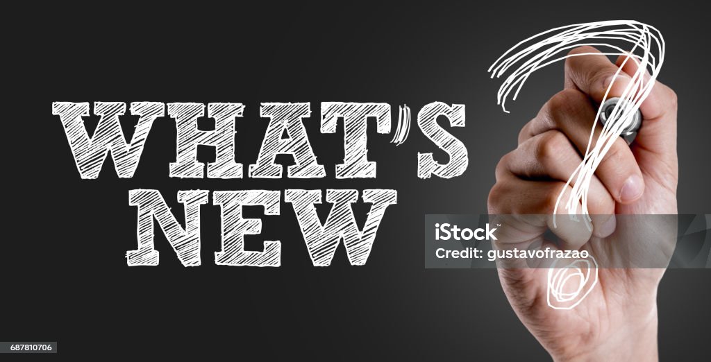 Whats New? Hand writing the text: Whats New? New Stock Photo