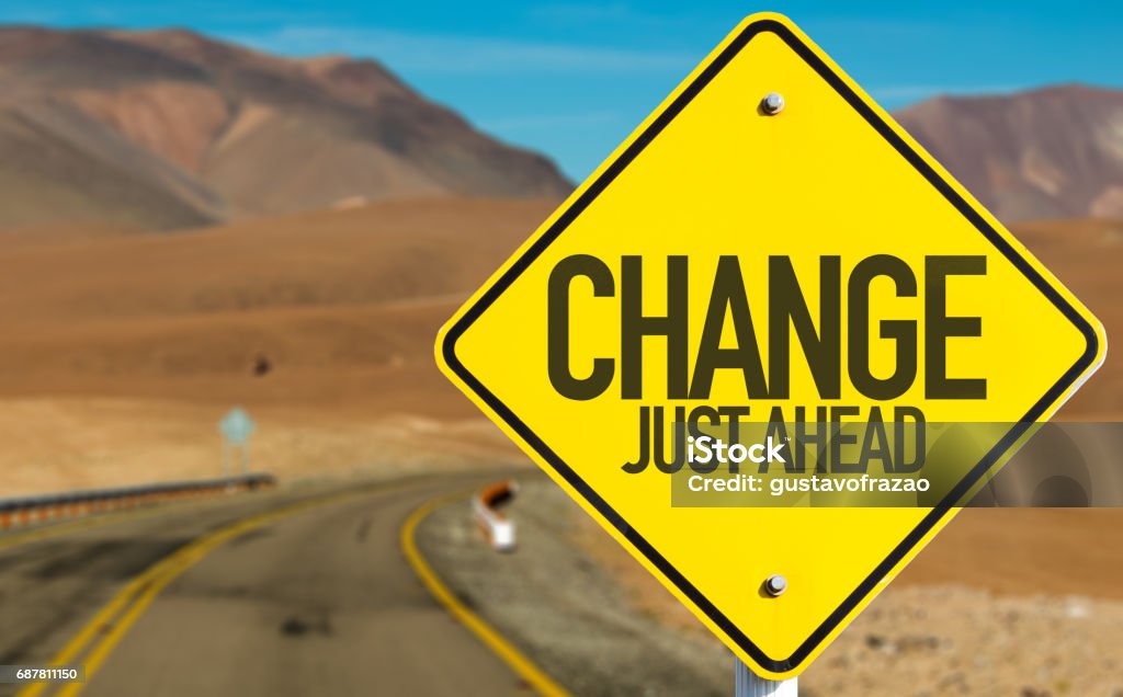 Change sign Change Just Ahead sign on desert road Change Stock Photo