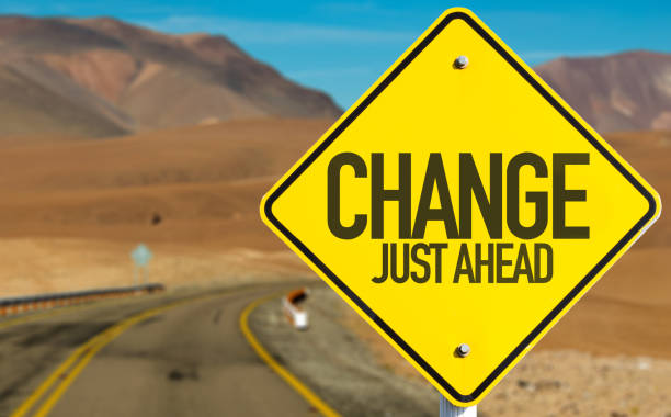Change sign Change Just Ahead sign on desert road adaptation concept stock pictures, royalty-free photos & images