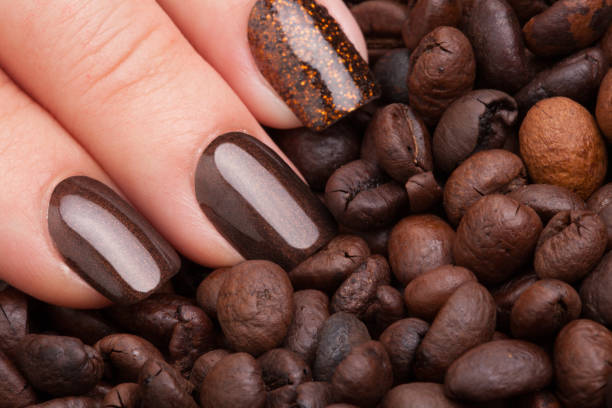 istock Brown nail polish on the nails. 687811204