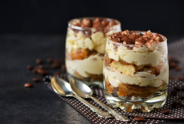 istock Classic tiramisu in a glass jar on the background chermon 687811324
