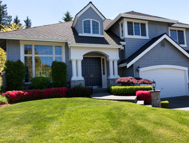 istock Well maintain front lawn of clean home during spring season 687813736