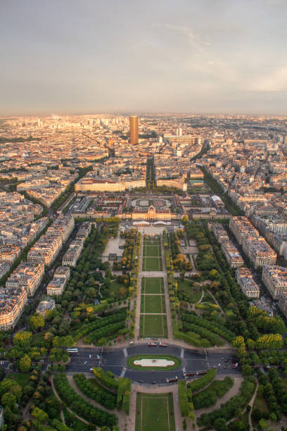 istock Golden sunset over paris: Champ de Mars viewed from Eiffel tower 687814164