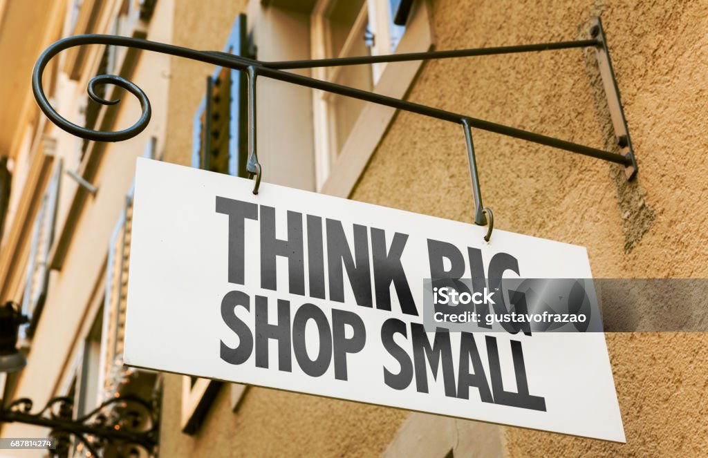Think Big Shop Small sign Think Big Shop Small sign in a conceptual image Small Business Stock Photo