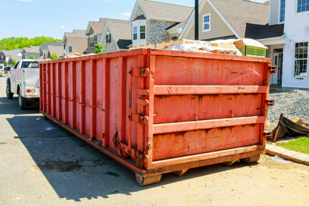 istock garbage containers near the new home, Red containers, recycling and waste construction site on the background 687816518