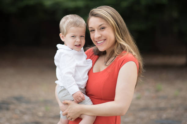istock Cute Millennial Mom Holding Toddler Son 687816980