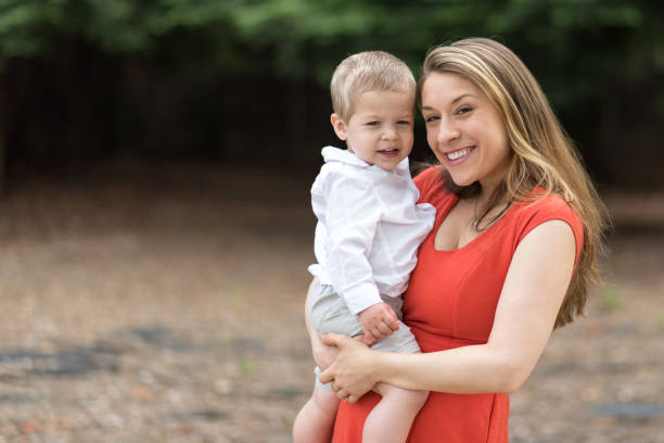 istock Cute Millennial Mom Holding Toddler Son 687817014