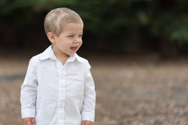 istock Cute Happy Toddler in White Shirt 687817074