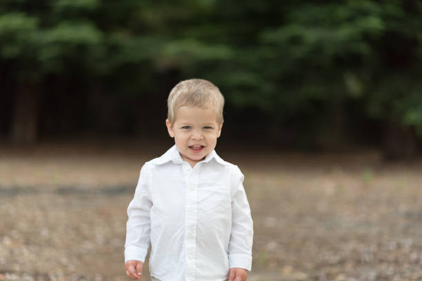 istock Cute Happy Toddler in White Shirt 687817082