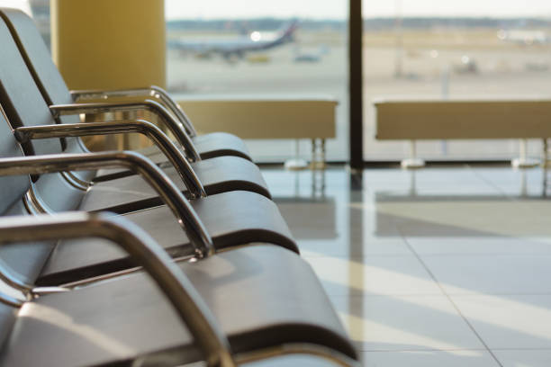 istock Empty chairs in the departure hall at airport 687820224