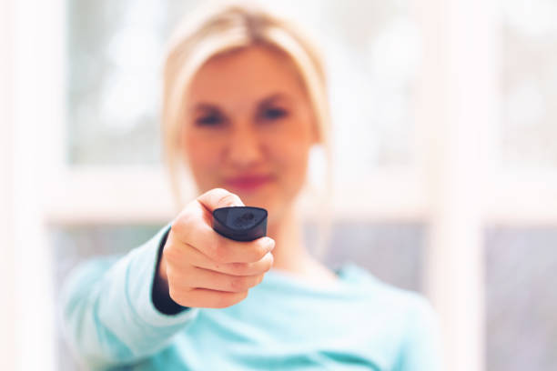 istock Young woman watching TV 687827870